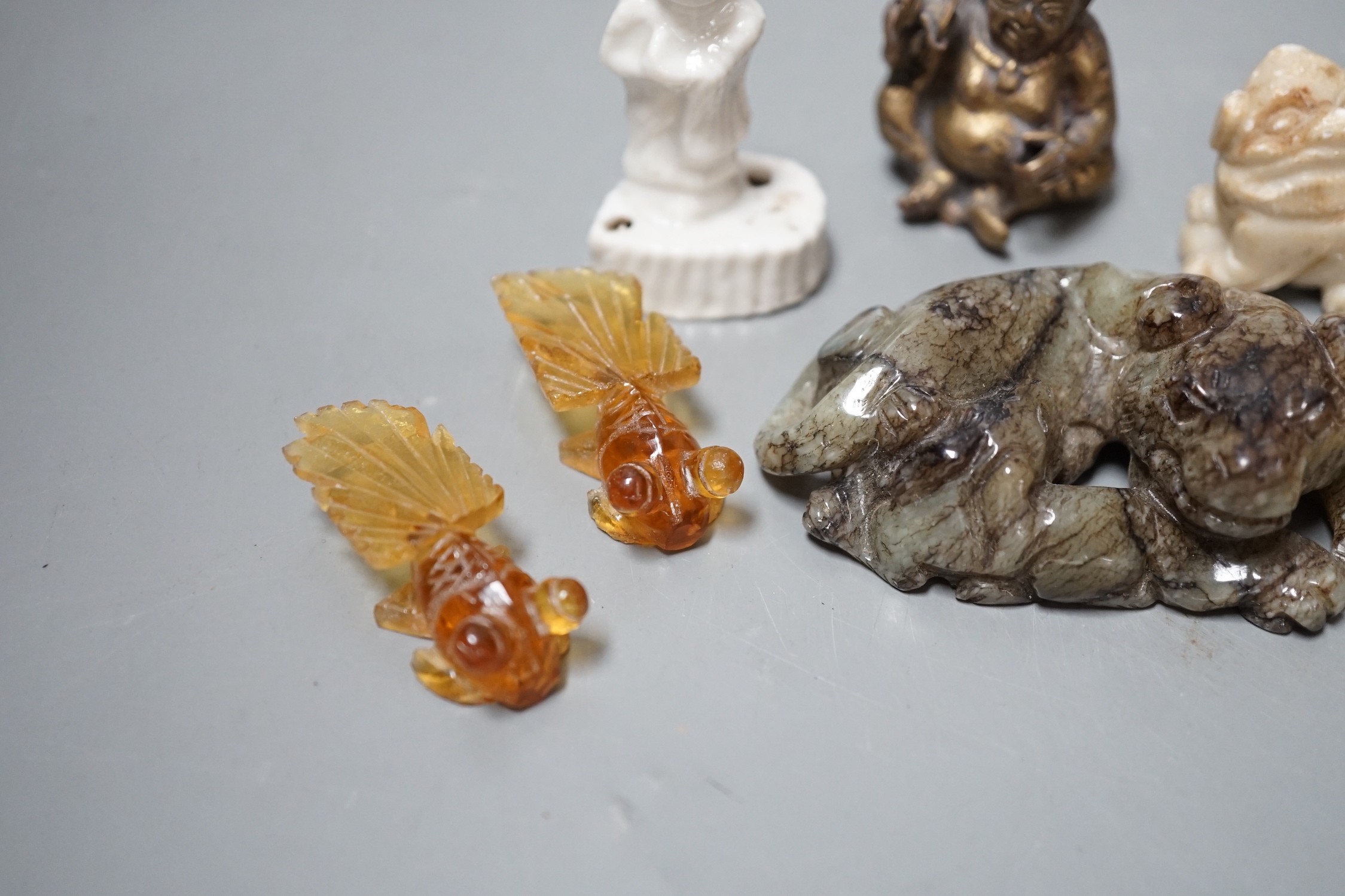 A group of Chinese jade, hardstone, faux amber carvings and models